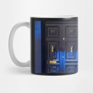 Blue wooden door with golden vintage knockers Mug